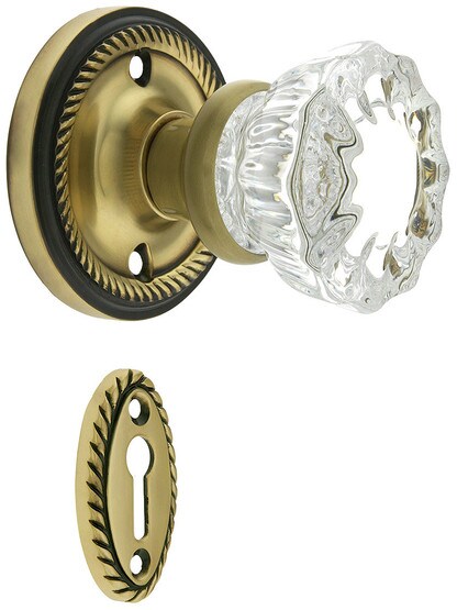 Rope Rosette Mortise Lock Set With Fluted Crystal Door Knobs in Antique Brass.